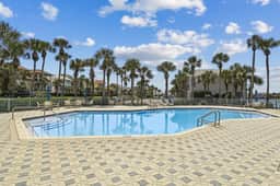 Mediterranean Home with Club Amenities & Golf Cart - Image 2